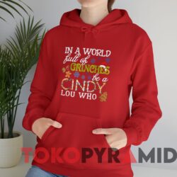 Vintage In A World Full Of Grinches Be A Cindy Lou Who Xmas Sweater Red Hoodie.